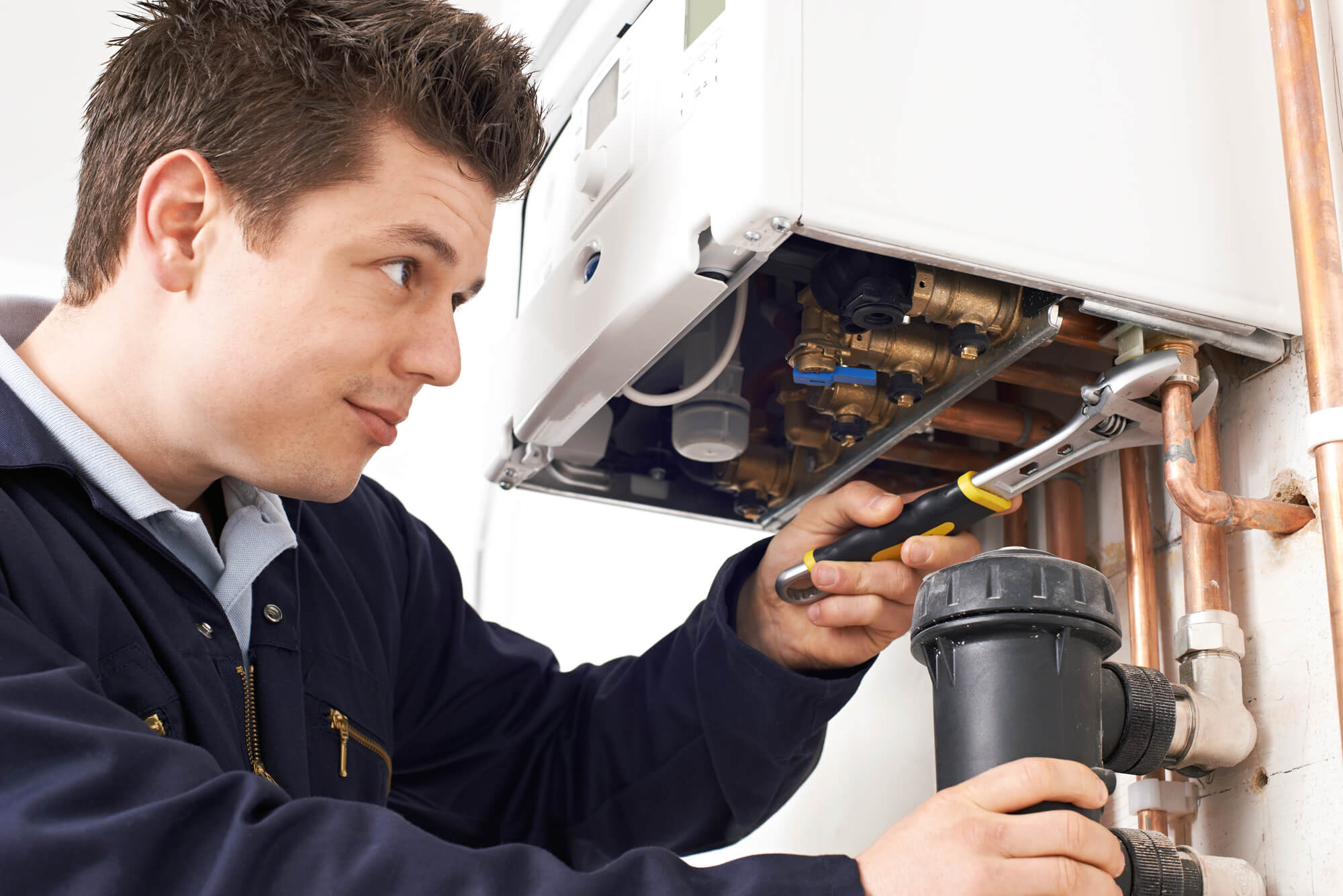 Engineer working on replacing a gas boiler